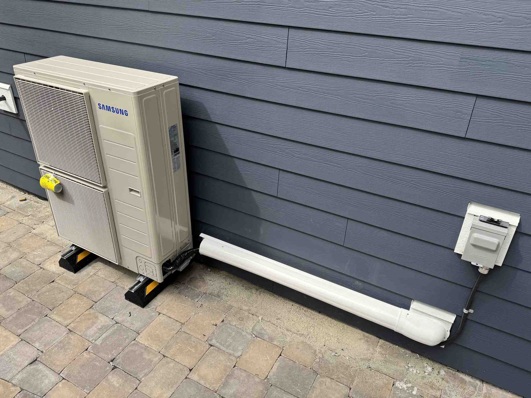 Samsung WindFree heat pump on exterior wall with Vancouver landscape