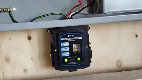 Eaton surge protector with green status LEDs mounted below panel