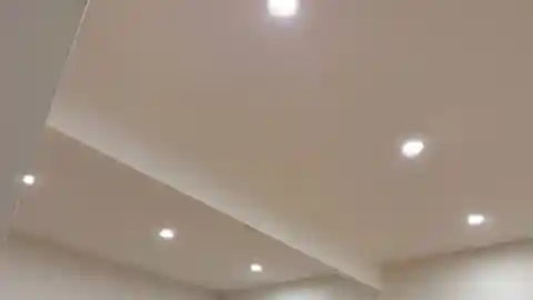 White ceiling with evenly spaced recessed LED pot lights