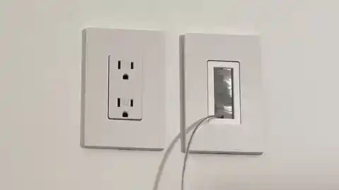 White electrical outlet and brush plate for TV wall mounting