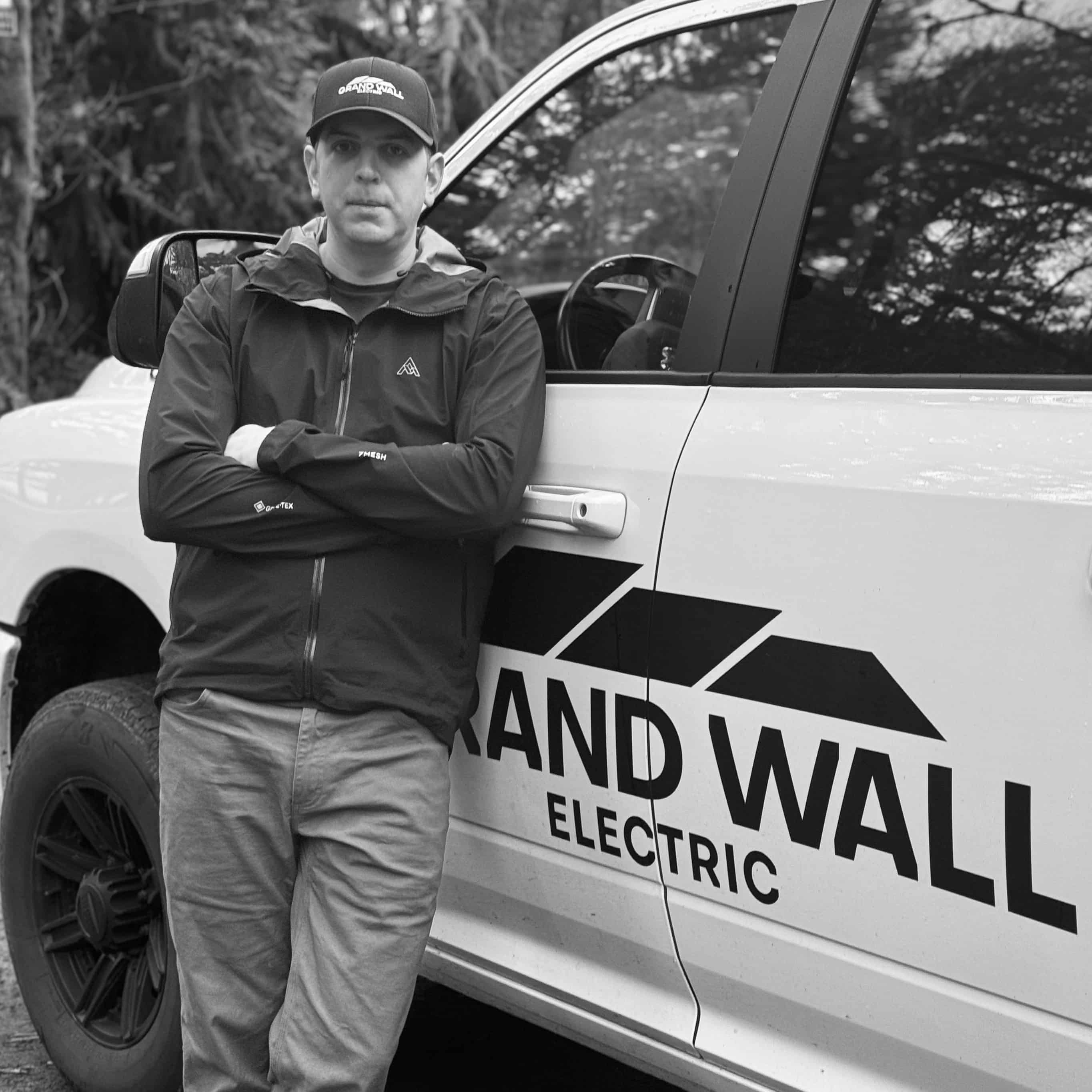 Matt, owner of Grand Wall Electric, beside his service truck